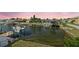 Waterfront view featuring a dock with boats and lush greenery, enhancing the property's appeal at 15621 Bertram Dr, Hudson, FL 34667