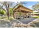Wooden barn with multiple stalls, offering ample space for livestock at 18826 Huckavalle Rd, Odessa, FL 33556