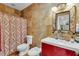 Bathroom features include decorative tile, modern fixtures, and a red vanity at 18826 Huckavalle Rd, Odessa, FL 33556