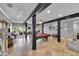 Spacious game room features a pool table and dark wood beams at 18826 Huckavalle Rd, Odessa, FL 33556