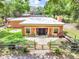Charming single-story home with a well-manicured front yard and inviting entrance at 18826 Huckavalle Rd, Odessa, FL 33556