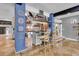 Stylish kitchen with custom backsplash, stainless steel appliances, breakfast bar and an open concept layout at 18826 Huckavalle Rd, Odessa, FL 33556