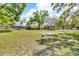 Picturesque view of the property featuring lush greenery and equestrian amenities at 18826 Huckavalle Rd, Odessa, FL 33556