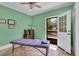 Tranquil room with natural light and ceiling fan, ideal for therapeutic massage and rejuvenation at 18826 Huckavalle Rd, Odessa, FL 33556