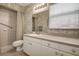 Bathroom featuring a shower, toilet, and sink with large mirror at 1920 Folkstone Pl, Wesley Chapel, FL 33543