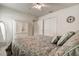 Bright bedroom featuring a ceiling fan, ample closet space, and decorative accents at 1920 Folkstone Pl, Wesley Chapel, FL 33543