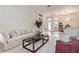 Bright and airy living room with neutral decor, comfortable seating, and an open layout at 1920 Folkstone Pl, Wesley Chapel, FL 33543