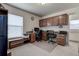 Office with carpet floors, cabinets, natural light, and desk at 1920 Folkstone Pl, Wesley Chapel, FL 33543