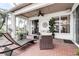 Relaxing outdoor patio with brick flooring and a view of surrounding landscape at 1920 Folkstone Pl, Wesley Chapel, FL 33543