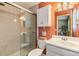 Modern bathroom featuring tiled walk-in shower, updated fixtures, and sleek vanity at 201 11Th S Ave, Safety Harbor, FL 34695