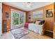 Bright bedroom with sliding glass door to outdoor patio space and comfortable daybed at 201 11Th S Ave, Safety Harbor, FL 34695