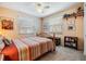 Comfortable bedroom with carpeted floors, ceiling fan and a bright, airy feel at 201 11Th S Ave, Safety Harbor, FL 34695