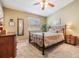 Comfortable bedroom with carpeted floors, ceiling fan and a bright, airy feel at 201 11Th S Ave, Safety Harbor, FL 34695