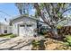Charming home exterior featuring a well-maintained front yard and a garage at 201 11Th S Ave, Safety Harbor, FL 34695