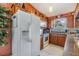 Bright kitchen with wooden cabinets, granite countertops, and stainless steel appliances at 201 11Th S Ave, Safety Harbor, FL 34695