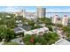 An aerial view of a building surrounded by lush green trees in a neighborhood setting at 2314 S Clewis Ct # 106, Tampa, FL 33629