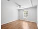 Well-lit bedroom featuring hardwood floors, neutral paint, a ceiling fan and a window view at 2314 S Clewis Ct # 106, Tampa, FL 33629