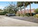 Apartment building featuring well maintained landscaping and ample parking for residents and visitors at 2314 S Clewis Ct # 106, Tampa, FL 33629