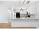 Modern kitchen with white cabinets, black appliances, and granite countertops at 2314 S Clewis Ct # 106, Tampa, FL 33629