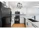 Updated kitchen featuring sleek black appliances and light granite countertops at 2314 S Clewis Ct # 106, Tampa, FL 33629