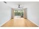Open living space with bamboo flooring and a sliding door to the private courtyard at 2314 S Clewis Ct # 106, Tampa, FL 33629