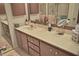 Bathroom featuring a long vanity with cabinets, a large mirror, and decor at 2725 14Th Ct, Palm Harbor, FL 34684