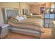 Mirrored bedroom with mirrored headboard on bed and ample storage space at 2725 14Th Ct, Palm Harbor, FL 34684