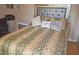 Bedroom featuring a comfortable bed with decorative pillows and a stylish headboard at 2725 14Th Ct, Palm Harbor, FL 34684
