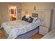 Bedroom featuring a comfortable bed with decorative pillows and a stylish headboard at 2725 14Th Ct, Palm Harbor, FL 34684