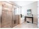 Bathroom showcasing a glass-enclosed shower and soaking tub with elegant tile work at 2855 Oriole Dr, Sarasota, FL 34243