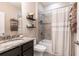 Cozy bathroom featuring a shower-tub combo and granite countertop with modern sink at 2855 Oriole Dr, Sarasota, FL 34243