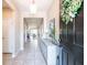 Open foyer showcasing neutral walls, tile flooring, and a decorative console table with decor at 2855 Oriole Dr, Sarasota, FL 34243