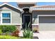 Inviting front entryway with a dark-stained door, stone accents, and manicured landscaping at 2855 Oriole Dr, Sarasota, FL 34243