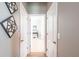 Hallway displaying wall decor leading to other rooms of the home at 2855 Oriole Dr, Sarasota, FL 34243