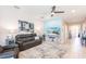 Inviting living room featuring comfortable seating, neutral decor, and a ceiling fan at 2855 Oriole Dr, Sarasota, FL 34243