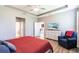 Spacious main bedroom with adjacent sitting area, wood floors and a tray ceiling at 2855 Oriole Dr, Sarasota, FL 34243