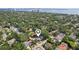 Aerial view of a neighborhood with mature trees and well-maintained homes, showcasing community charm at 3131 W Fielder St, Tampa, FL 33611