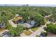 Aerial view showcasing the home's location amidst a lush, green neighborhood with a glimpse of the bay at 3131 W Fielder St, Tampa, FL 33611