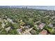 Expansive aerial view highlighting the home's prime location near lush greenery, water, and city skyline views at 3131 W Fielder St, Tampa, FL 33611