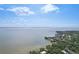 Aerial view of waterfront property with stunning ocean views and lush green surroundings at 3131 W Fielder St, Tampa, FL 33611