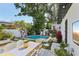 Inviting backyard features a pool, outdoor seating, and lush landscaping at 3131 W Fielder St, Tampa, FL 33611