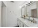 Bright bathroom featuring double sinks, sleek vanity, and modern fixtures at 3131 W Fielder St, Tampa, FL 33611