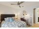 Comfortable bedroom with desk, neutral tones, and a ceiling fan for added comfort at 3131 W Fielder St, Tampa, FL 33611