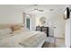 Bright bedroom featuring stylish furniture, neutral tones, and a ceiling fan for added comfort at 3131 W Fielder St, Tampa, FL 33611