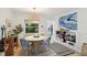 Bright dining area features a round table, stylish chairs, and large windows offering lush views at 3131 W Fielder St, Tampa, FL 33611