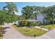Beautiful home with a well-manicured lawn and mature trees at 3131 W Fielder St, Tampa, FL 33611