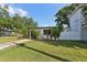 Beautiful home with green grass and lush landscaping at 3131 W Fielder St, Tampa, FL 33611