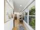 Hallway with ample windows, natural light, and stylish decor, creating a welcoming atmosphere at 3131 W Fielder St, Tampa, FL 33611