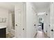 Hallway showing access to a bathroom and bedroom, demonstrating the home's layout and flow at 3131 W Fielder St, Tampa, FL 33611