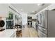 Modern kitchen with stainless steel appliances, white cabinets, and a breakfast area with outdoor view at 3131 W Fielder St, Tampa, FL 33611